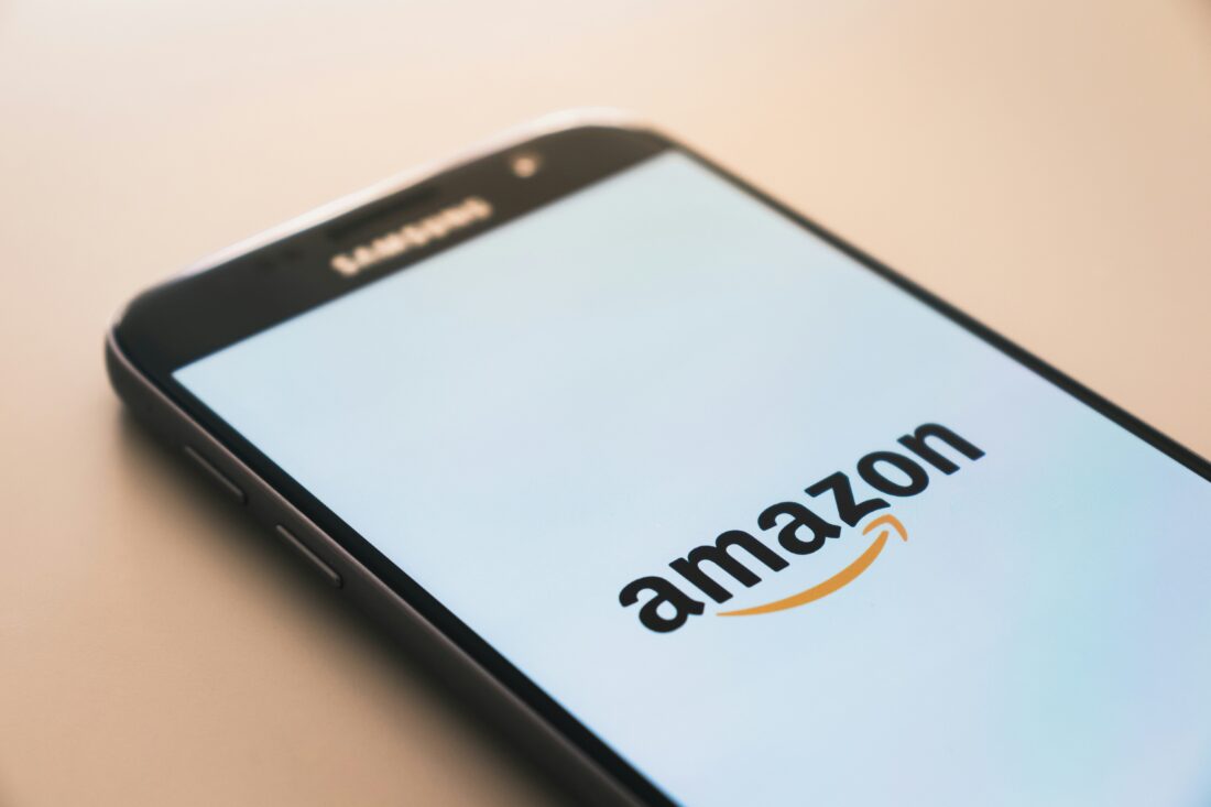 black smartphone displaying amazon logo