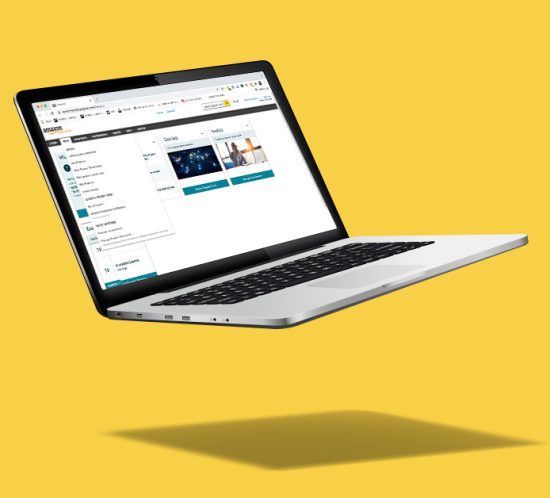 laptop open to amazon with yellow background